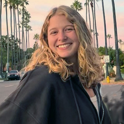 smiling woman with cucly blonde hair