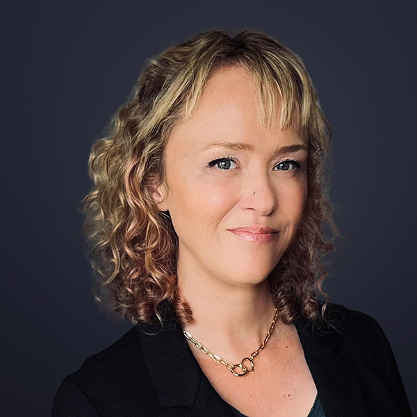 woman smiling with curly blonde hair