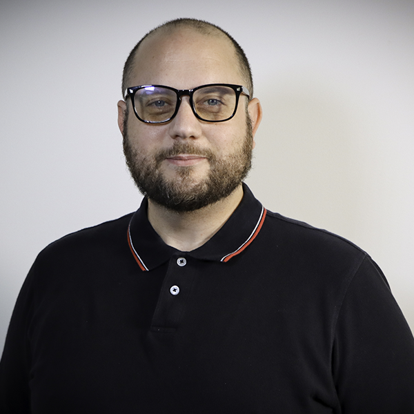 man with glasses and beard smiling
