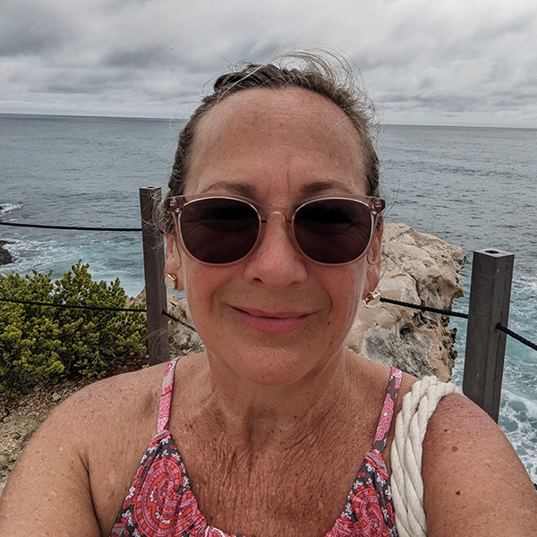 woman at beach wearing glasses