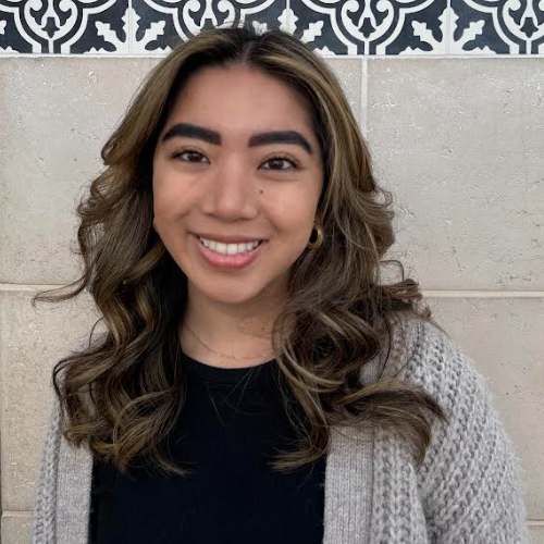 woman smiling with long wavy hair