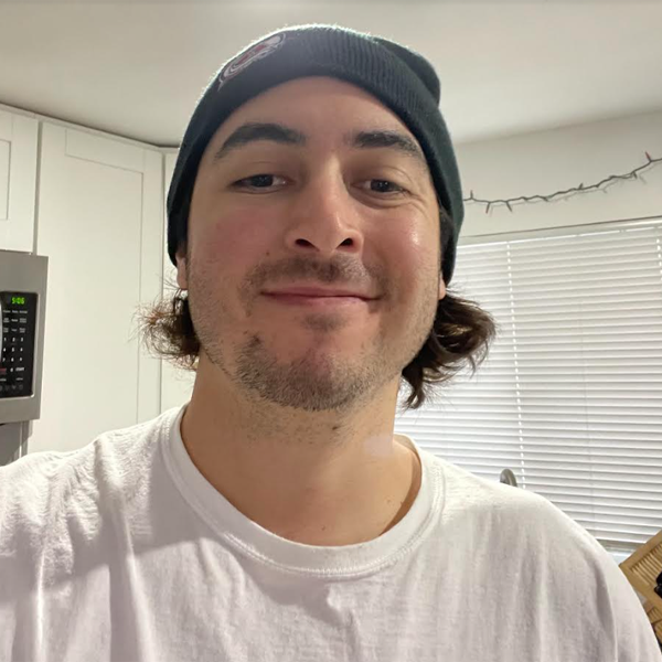 man smiling wearing a beanie