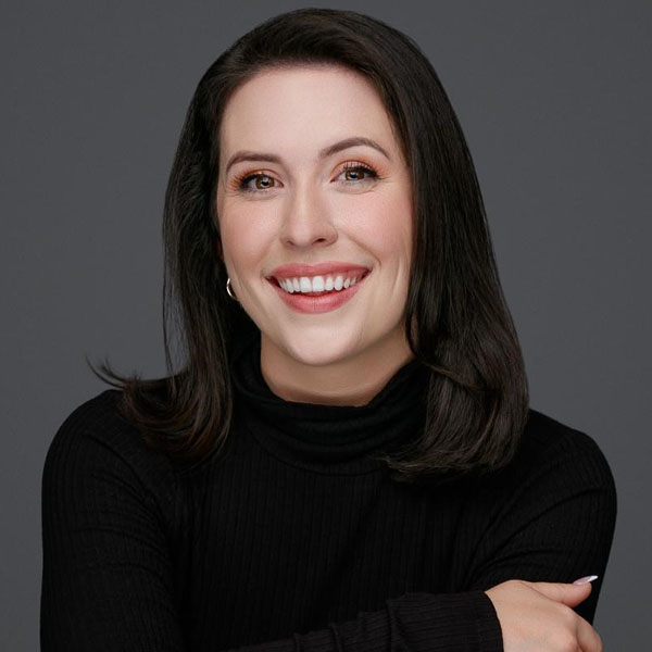woman with dark hair smiling