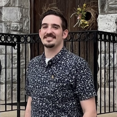 man with goatee smiling