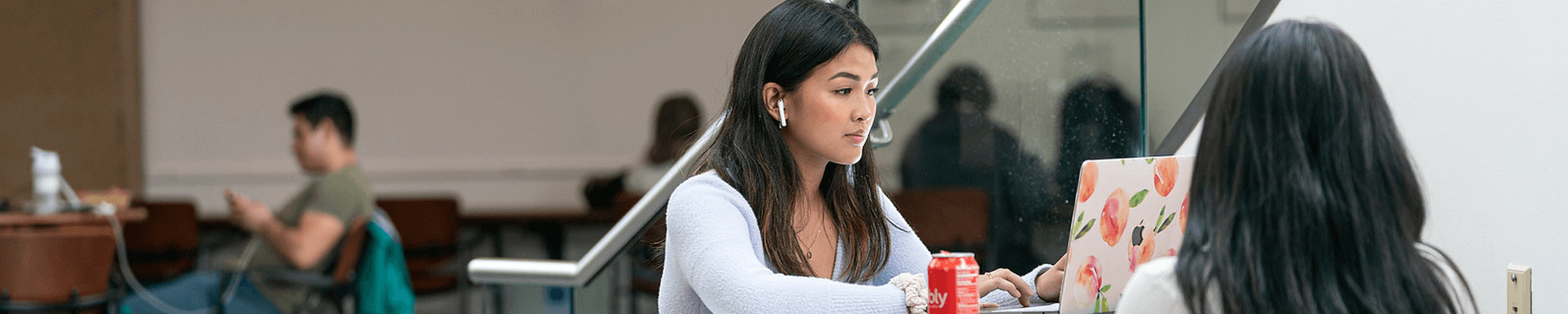 student typing on computer